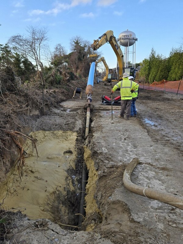 This photo from Dec. 21 shows the canal crossing construction. The blue pipe is the new 16-inch water main about to be pulled underground near the Lewes-Georgetown Trail at Gills Neck Road. TOM PANETTA PHOTO